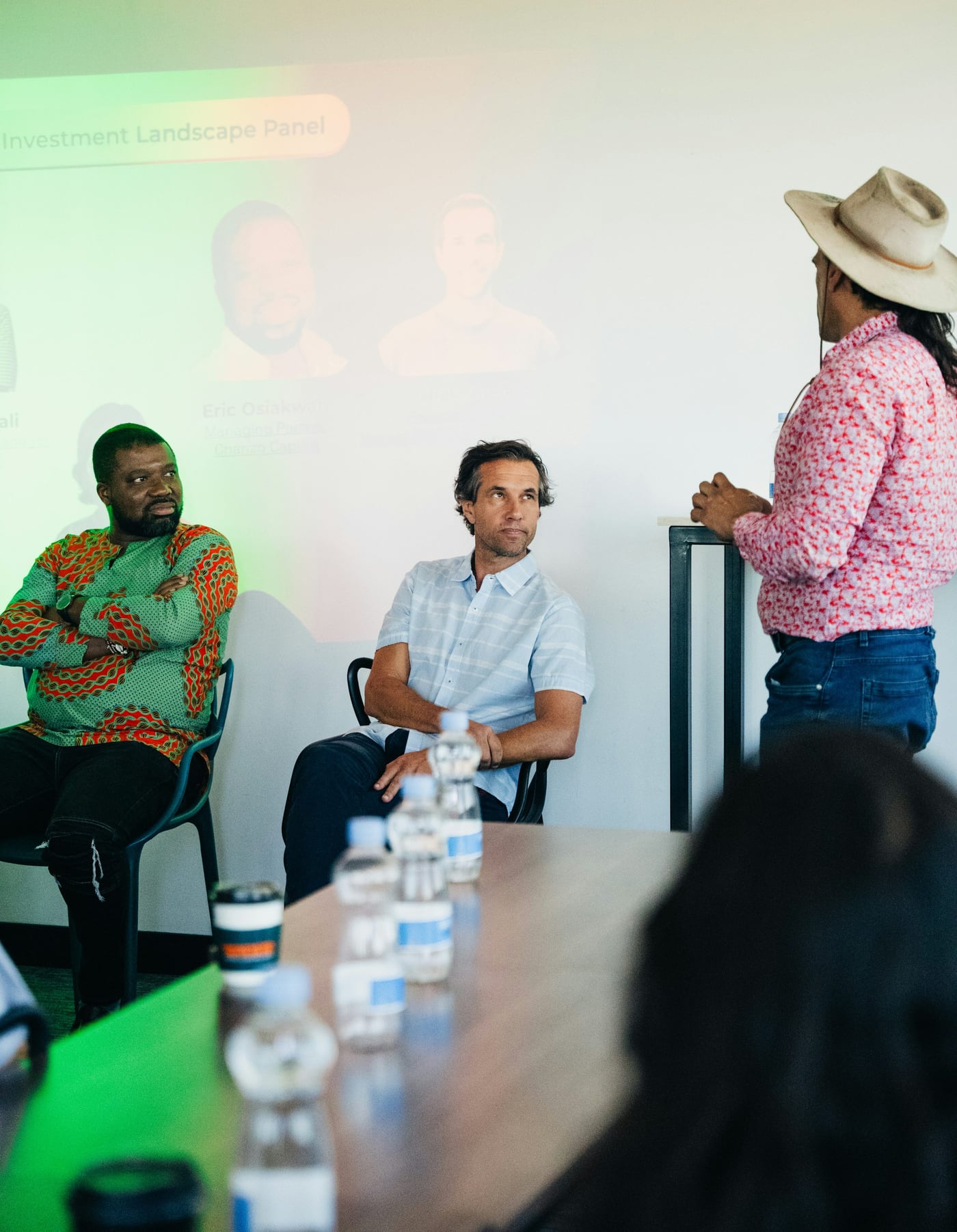 Panel discussion with diverse speakers in a modern room